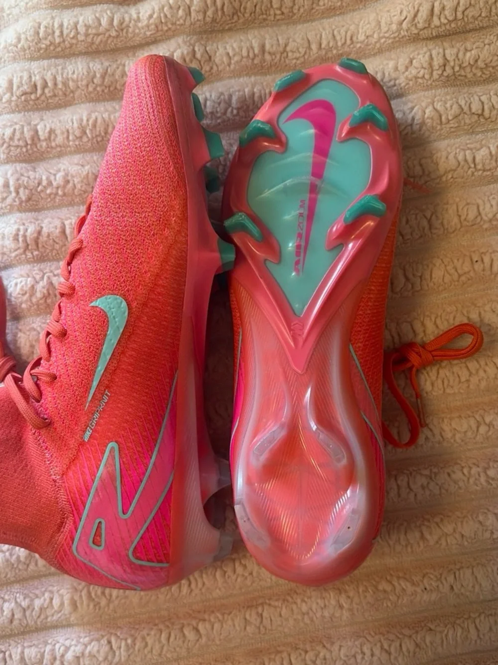 Nike Women's Pink Soccer Cleats with Teal Swoosh